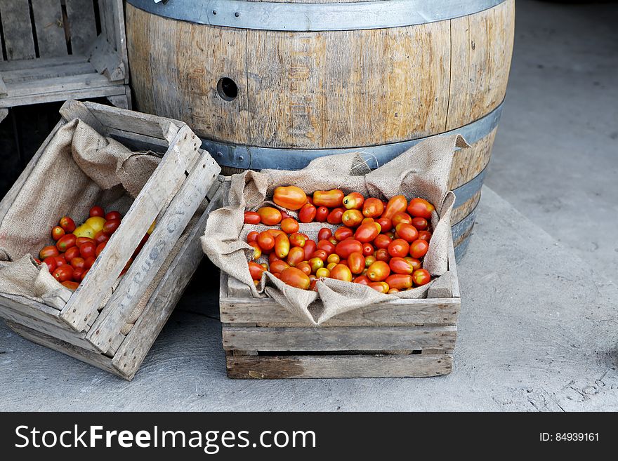 Orange Tomato on Brown Wooden Crate