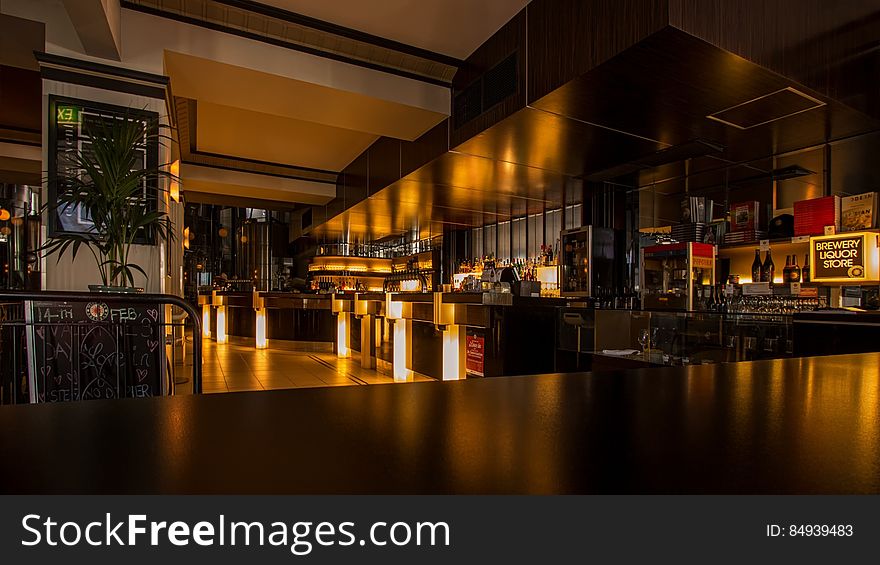 A view inside a restaurant across the bar desk. A view inside a restaurant across the bar desk.