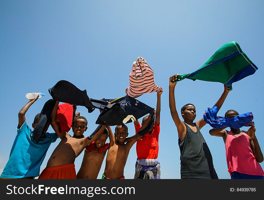 Somali children hold their shirts aloft to dry in the wind at Lido Beach in the Abdul-Aziz district of the Somali capital Mogadishu 09 November 2012. Lido Beach has become a popular spot on Friday&#x27;s with hundreds of Somalis since the withdrawal in August 2011 of the Al-Qaeda affiliated extremist group Al Shabaab who had banned any such social gatherings between men and women. The United Nations Security Council on November 7 renewed the mandate of the African Union Mission in Somalia &#x28;AMISOM&#x29; peacekeeping force for a further four months to continue providing support to the Government of Somalia in its efforts to bring peace and stability to the Horn of African country. AU-UN IST PHOTO / STUART PRICE. Somali children hold their shirts aloft to dry in the wind at Lido Beach in the Abdul-Aziz district of the Somali capital Mogadishu 09 November 2012. Lido Beach has become a popular spot on Friday&#x27;s with hundreds of Somalis since the withdrawal in August 2011 of the Al-Qaeda affiliated extremist group Al Shabaab who had banned any such social gatherings between men and women. The United Nations Security Council on November 7 renewed the mandate of the African Union Mission in Somalia &#x28;AMISOM&#x29; peacekeeping force for a further four months to continue providing support to the Government of Somalia in its efforts to bring peace and stability to the Horn of African country. AU-UN IST PHOTO / STUART PRICE.