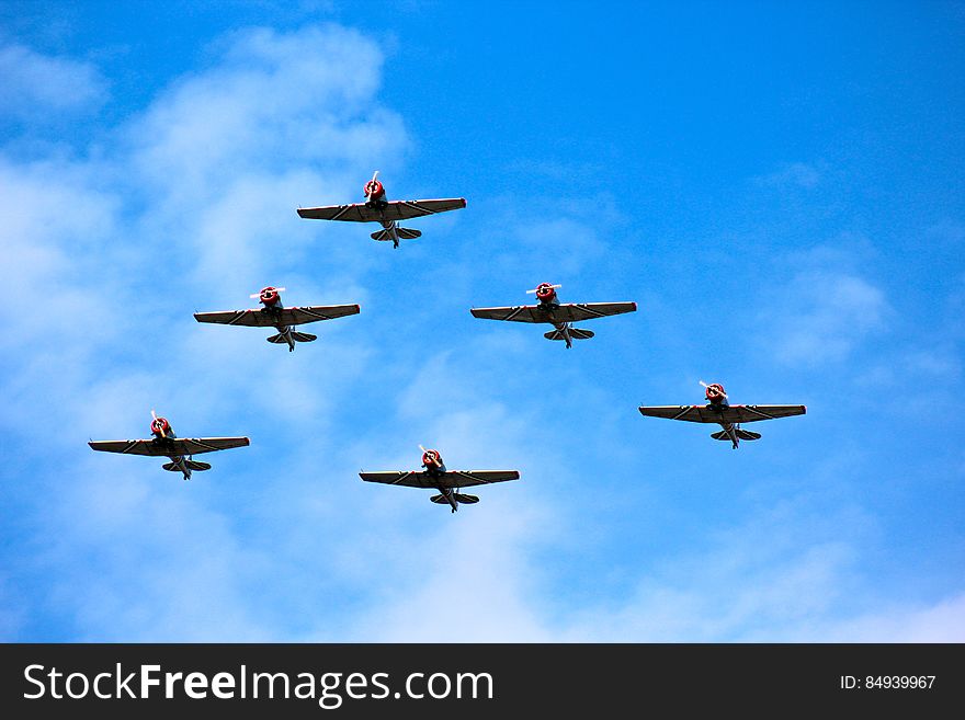 A historical fighter plane squadron flying in formation. A historical fighter plane squadron flying in formation.