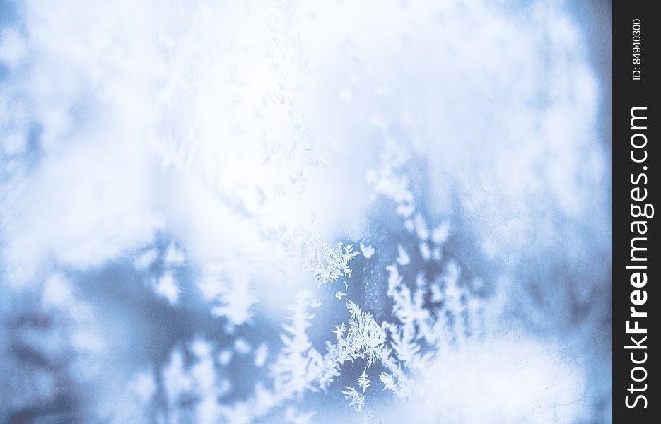 A close up shot of blurred snowflakes.