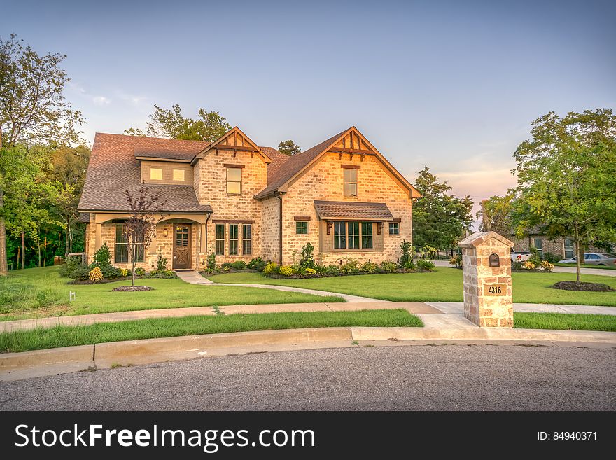 An elegant old fashioned countryside house with a lawn. An elegant old fashioned countryside house with a lawn.