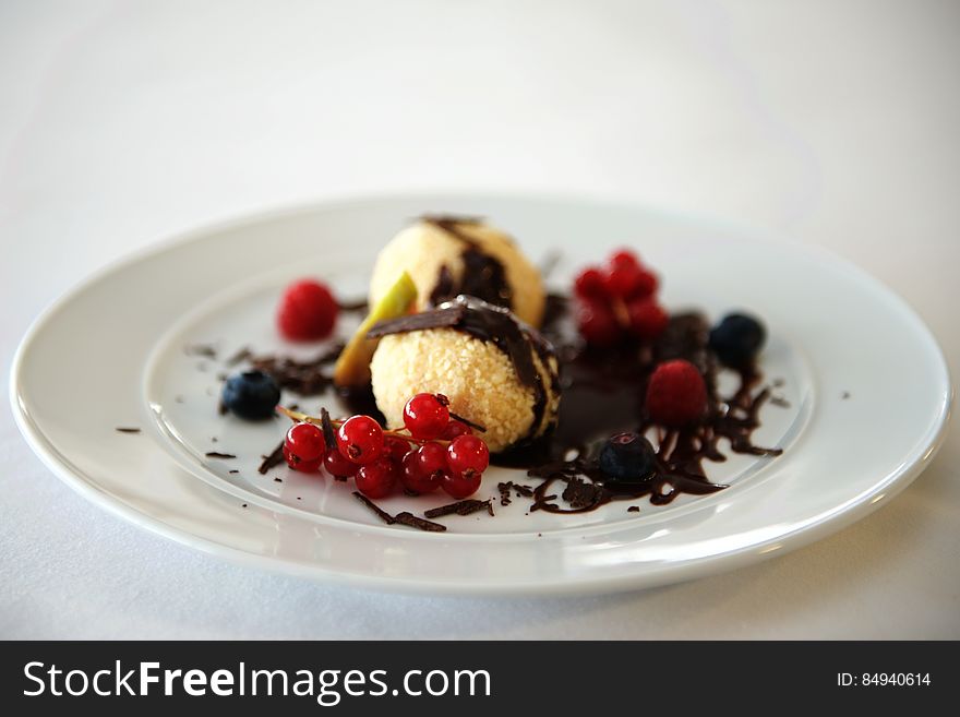 A dessert with chocolate and red currants. A dessert with chocolate and red currants.