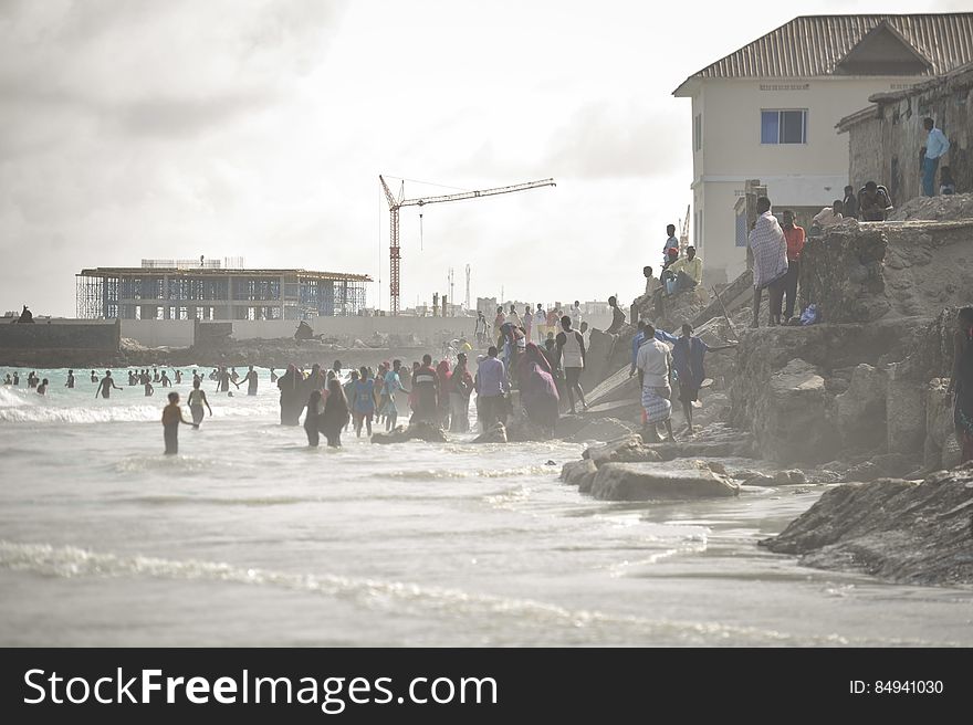 People stand in the ocean on Lido beach in Mogadishu, Somalia, during Eid al-Fitr on July 28. AMISOM Photo / Tobin Jones. People stand in the ocean on Lido beach in Mogadishu, Somalia, during Eid al-Fitr on July 28. AMISOM Photo / Tobin Jones