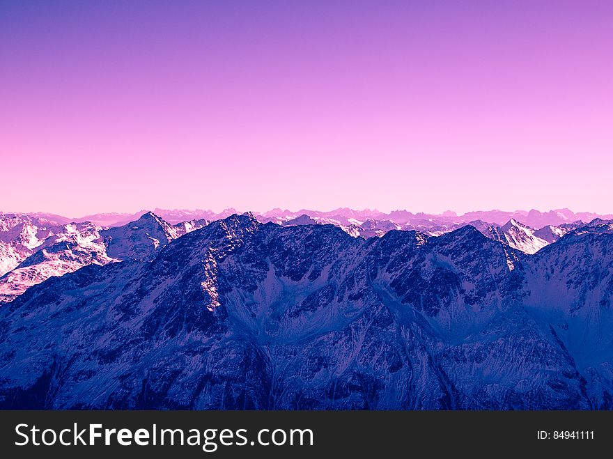 A mountain range with false color skies.