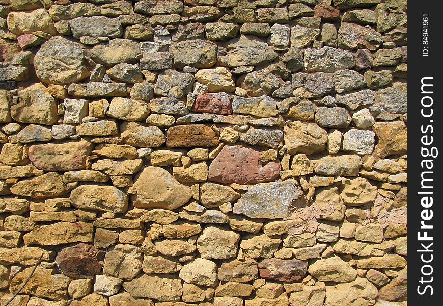 Bedrock, Brickwork, Brick, Flagstone, Building material, Stone wall