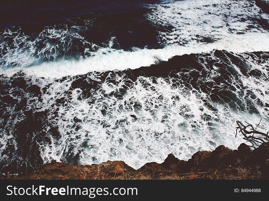 Cliff Side View Of Ocean Waves