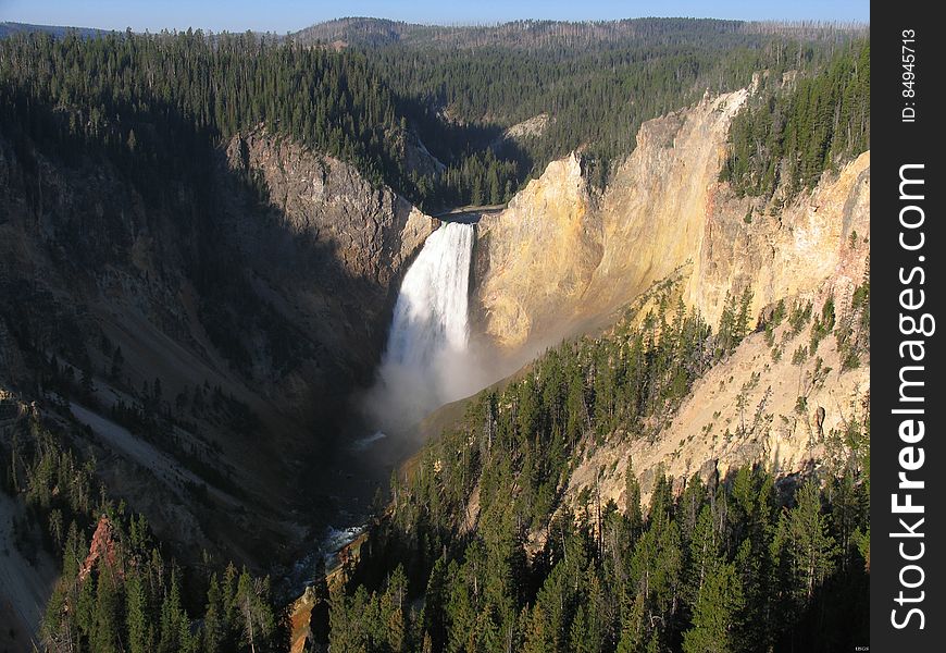 This is nearly the same view depicted in the 1872 sketch by Thomas Moran, and printed for the 150th anniversary commemoration of the Department of the Interior. The splendid yellow-brown walls of the canyon consist predominantly of rhyolite tuff and lava &#x28;Sulfur Creek Tuff and Canyon flow, respectively&#x29;, which were erupted nearly 500,000 years ago. Both units have been intensely altered by hydrothermal fluids. Location: Yellowstone National Park, WY, USA Photographer: Stewart Tomlinson, USGS. This is nearly the same view depicted in the 1872 sketch by Thomas Moran, and printed for the 150th anniversary commemoration of the Department of the Interior. The splendid yellow-brown walls of the canyon consist predominantly of rhyolite tuff and lava &#x28;Sulfur Creek Tuff and Canyon flow, respectively&#x29;, which were erupted nearly 500,000 years ago. Both units have been intensely altered by hydrothermal fluids. Location: Yellowstone National Park, WY, USA Photographer: Stewart Tomlinson, USGS