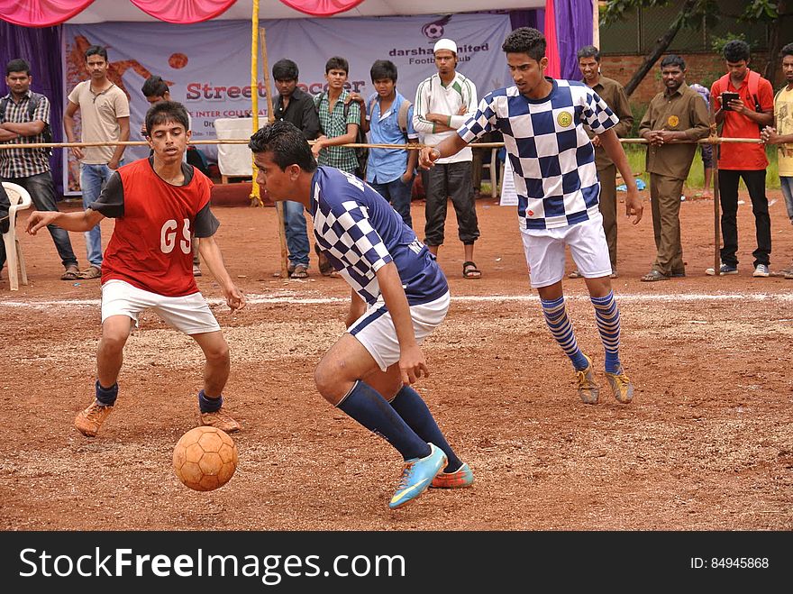 Indian football teams playing soccer in front of spectators. Indian football teams playing soccer in front of spectators.