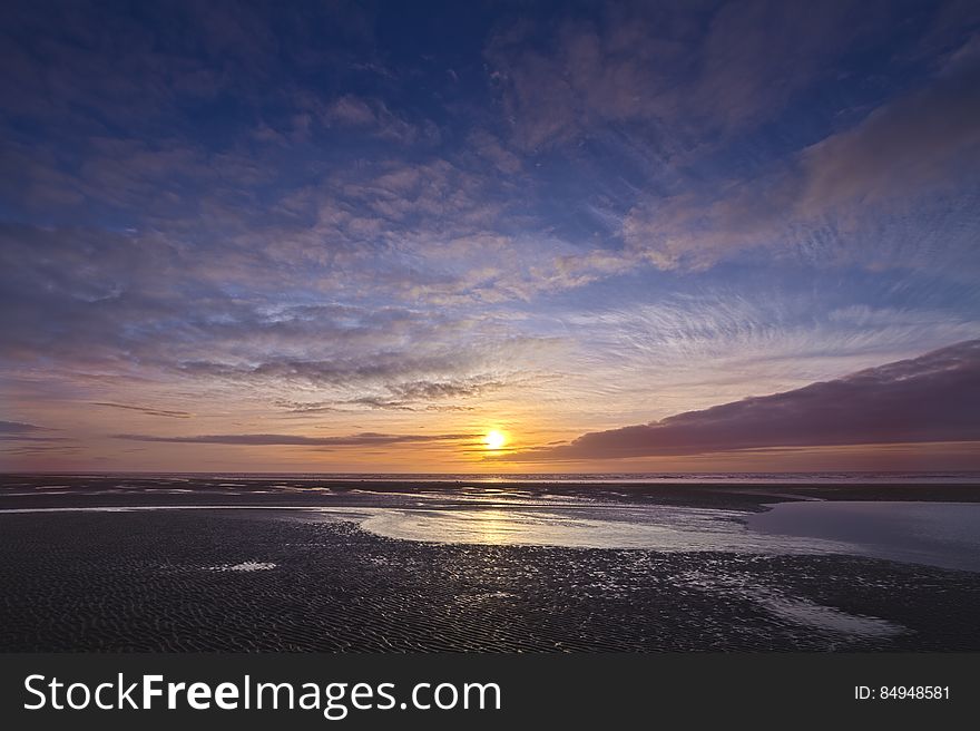 Here is an hdr photograph of a sunset taken from beach in Cleveleys, Lancashire, England, UK. Here is an hdr photograph of a sunset taken from beach in Cleveleys, Lancashire, England, UK.