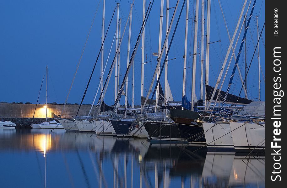 Boats In Harbor At Night