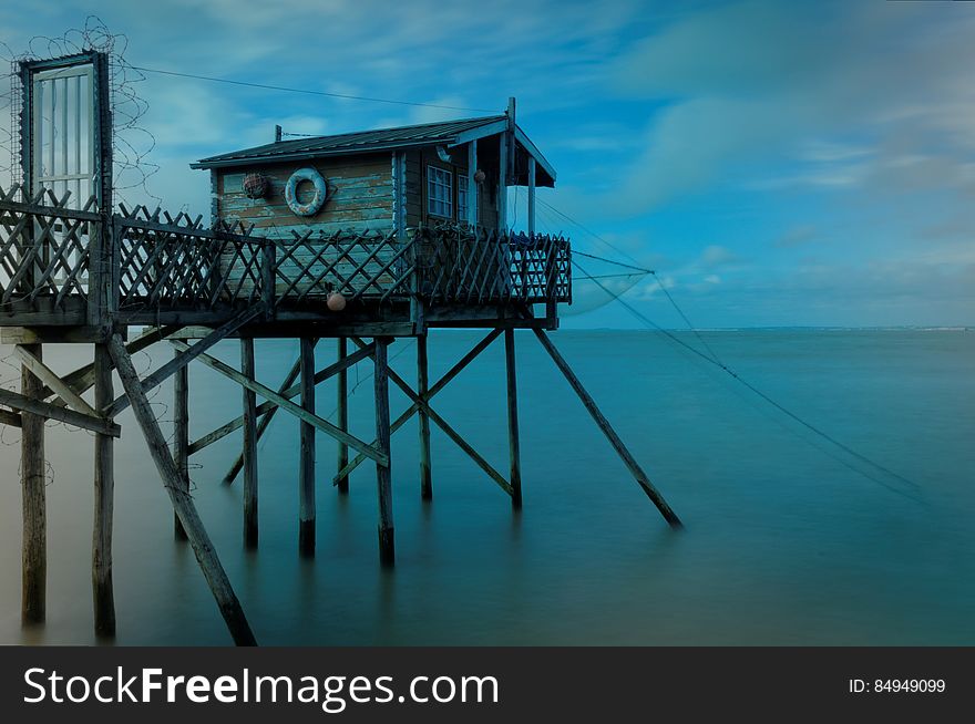 A hut on a pier by the sea. A hut on a pier by the sea.