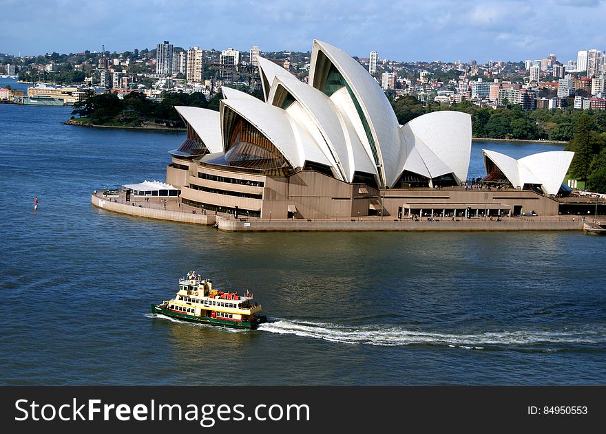 The Sydney Opera House is a multi-venue performing arts centre in Sydney, New South Wales, Australia. Situated on Bennelong Point in Sydney Harbour, close to the Sydney Harbour Bridge, the facility is adjacent to the Sydney central business district and the Royal Botanic Gardens, between Sydney and Farm Coves. Designed by Danish architect JÃ¸rn Utzon, the facility formally opened on 20 October 1973 after a gestation beginning with Utzon&#x27;s 1957 selection as winner of an international design competition. The Government of New South Wales, led by the premier, Joseph Cahill, authorised work to begin in 1958 with Utzon directing construction. The government&#x27;s decision to build Utzon&#x27;s design is often overshadowed by circumstances that followed, including cost and scheduling overruns as well as the architect&#x27;s ultimate resignation. The Sydney Opera House is a multi-venue performing arts centre in Sydney, New South Wales, Australia. Situated on Bennelong Point in Sydney Harbour, close to the Sydney Harbour Bridge, the facility is adjacent to the Sydney central business district and the Royal Botanic Gardens, between Sydney and Farm Coves. Designed by Danish architect JÃ¸rn Utzon, the facility formally opened on 20 October 1973 after a gestation beginning with Utzon&#x27;s 1957 selection as winner of an international design competition. The Government of New South Wales, led by the premier, Joseph Cahill, authorised work to begin in 1958 with Utzon directing construction. The government&#x27;s decision to build Utzon&#x27;s design is often overshadowed by circumstances that followed, including cost and scheduling overruns as well as the architect&#x27;s ultimate resignation