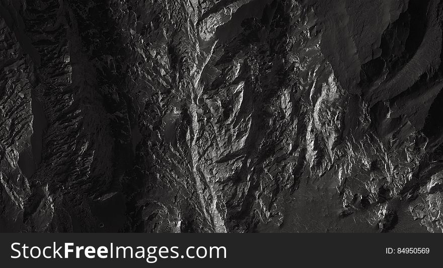 A bleak rocky background in black and white.