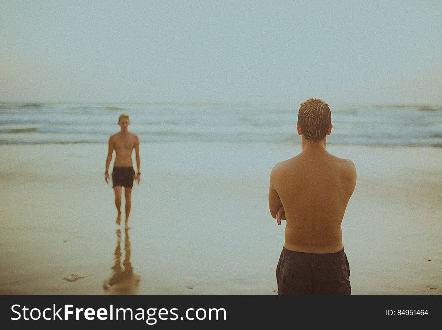 Swimmers On Wet Beach