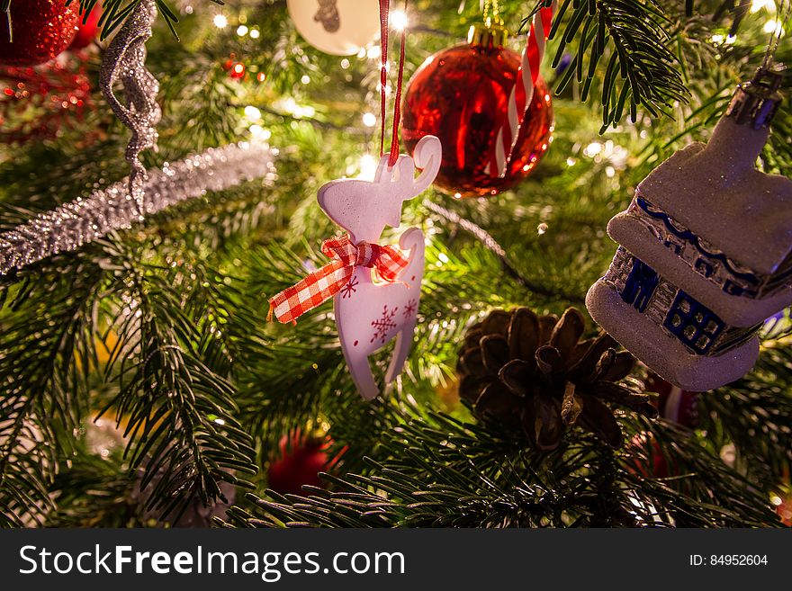 Reindeer Ornament Hanging On Christmas Tree