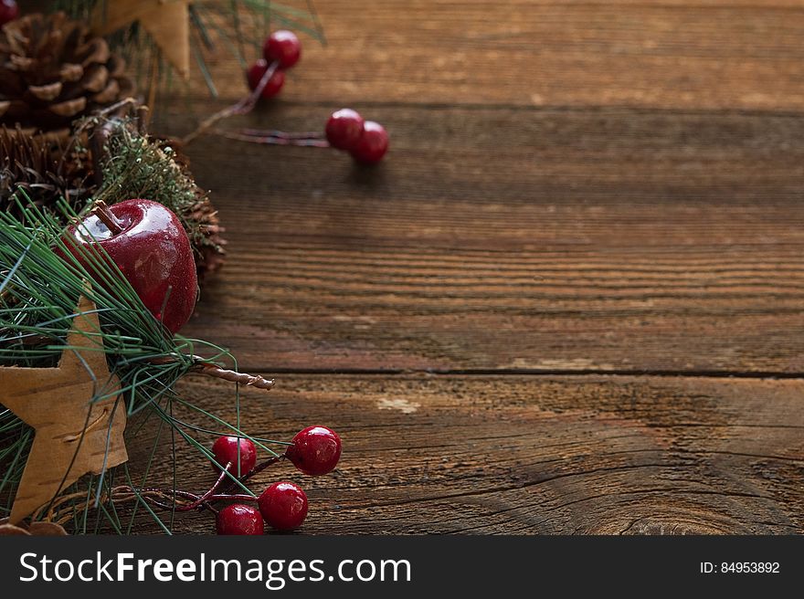 Different Christmas decorations on a wooden background.