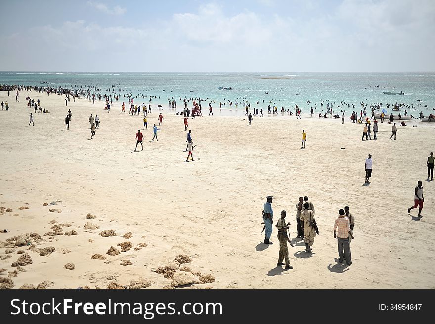 Residents of Mogadishu enjoy Lido beach, while police stand guard outside of a restaurant, on January 31 in Somalia. The Mogadishu lifeguards, consisting entirely of a volunteer force of fisherman, began patrolling Lido beach in September 2013 after a spate of drownings. Mogadishu&#x27;s beaches have become a popular destination for the city&#x27;s residents since al Shabab withdrew the majority of its militants from the city in 2011. AU UN IST PHOTO / Tobin Jones. Residents of Mogadishu enjoy Lido beach, while police stand guard outside of a restaurant, on January 31 in Somalia. The Mogadishu lifeguards, consisting entirely of a volunteer force of fisherman, began patrolling Lido beach in September 2013 after a spate of drownings. Mogadishu&#x27;s beaches have become a popular destination for the city&#x27;s residents since al Shabab withdrew the majority of its militants from the city in 2011. AU UN IST PHOTO / Tobin Jones