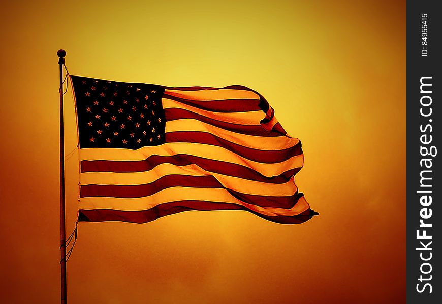 USA flag on yellow backdrop