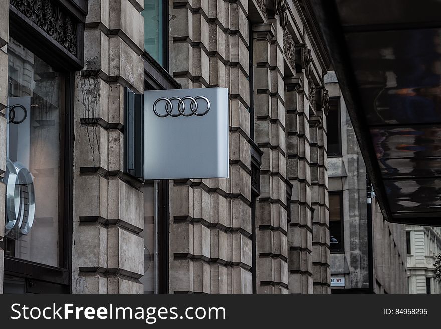 An Audi sign on the dealer's wall. An Audi sign on the dealer's wall.