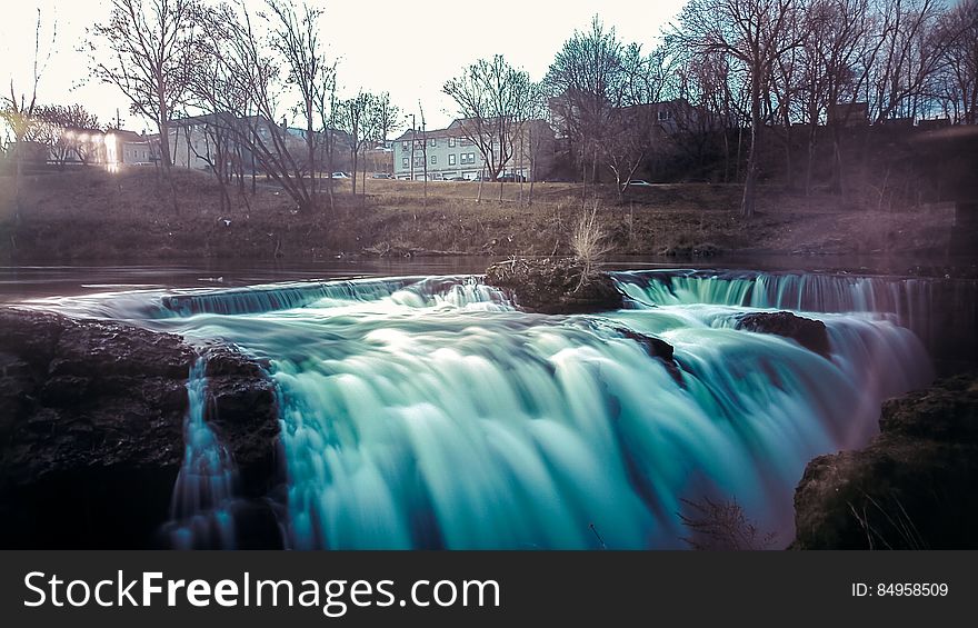 A long exposure of a waterfall cascading down from a small stream. A long exposure of a waterfall cascading down from a small stream.