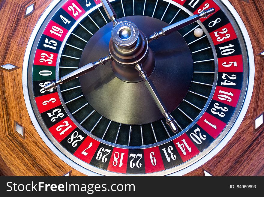 A close up of a roulette wheel in a casino.