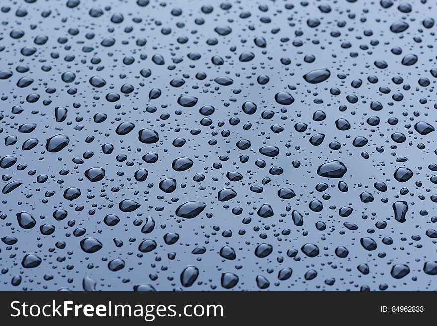 Water Droplets On Blue Surface