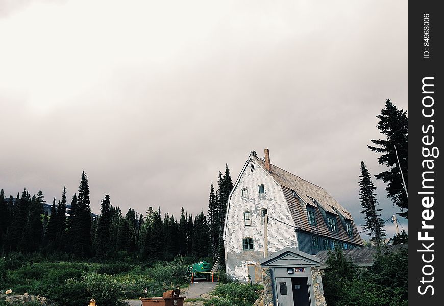 White Gray House Beside Tree&x27;s During Daytime