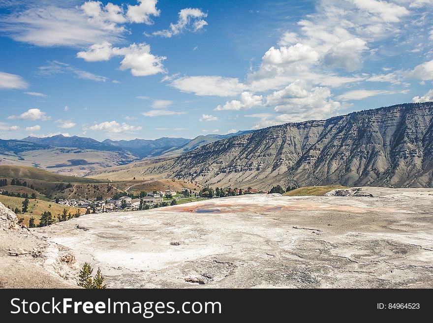 A view from a mountain plateau across the valley and mountains in the distance. A view from a mountain plateau across the valley and mountains in the distance.