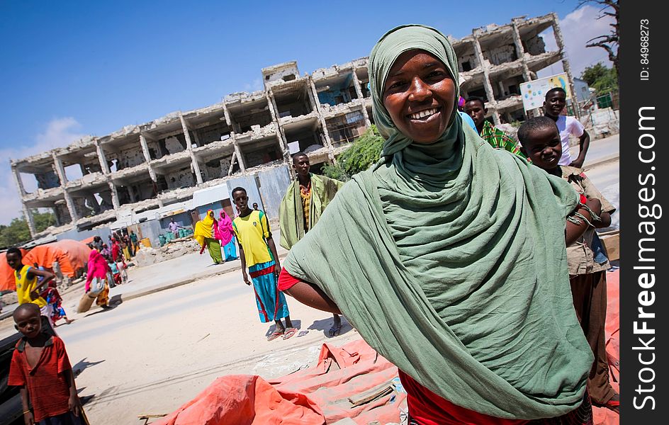 A Somali woman stands in front of a derelict building in the Abdul-Aziz district of the Somali capital Mogadishu 09 November. The United Nations Security Council on November 7 renewed the mandate of the African Union Mission in Somalia &#x28;AMISOM&#x29; peacekeeping force for a further four months to continue providing support to the Government of Somalia in its efforts to bring peace and stability to the Horn of African country. AU-UN IST PHOTO / STUART PRICE. A Somali woman stands in front of a derelict building in the Abdul-Aziz district of the Somali capital Mogadishu 09 November. The United Nations Security Council on November 7 renewed the mandate of the African Union Mission in Somalia &#x28;AMISOM&#x29; peacekeeping force for a further four months to continue providing support to the Government of Somalia in its efforts to bring peace and stability to the Horn of African country. AU-UN IST PHOTO / STUART PRICE.