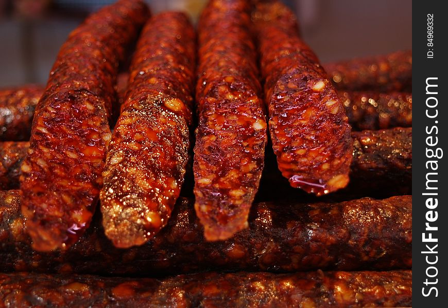 A stack of spicy cured sausages at grill. A stack of spicy cured sausages at grill.