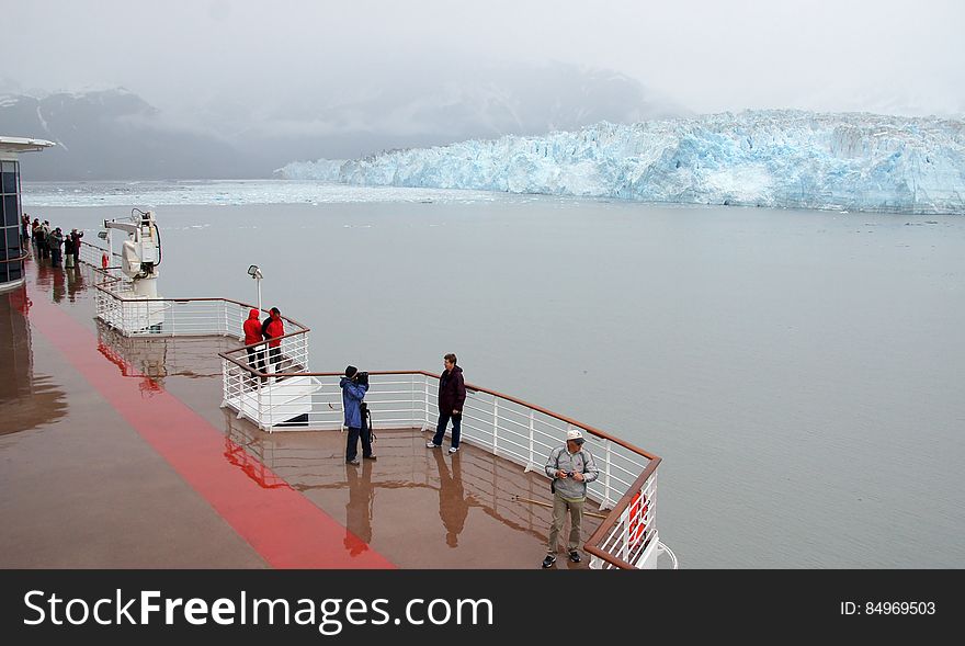The longest source for Hubbard Glacier originates 122 kilometres &#x28;76 mi&#x29; from its snout and is located at about 61°00′N 140°09′W, approximately 8 kilometres &#x28;5 mi&#x29; west of Mount Walsh with an altitude around 11,000 feet &#x28;3,400 m&#x29;. A shorter tributary glacier begins at the easternmost summit on the Mount Logan ridge at about 18,300 feet &#x28;5,600 m&#x29; at about 60°35′0″N 140°22′40″W. Before it reaches the sea, Hubbard is joined by the Valerie Glacier to the west, which, through forward surges of its own ice, has contributed to the advance of the ice flow that experts believe will eventually dam the Russell Fjord from Disenchantment Bay waters. The longest source for Hubbard Glacier originates 122 kilometres &#x28;76 mi&#x29; from its snout and is located at about 61°00′N 140°09′W, approximately 8 kilometres &#x28;5 mi&#x29; west of Mount Walsh with an altitude around 11,000 feet &#x28;3,400 m&#x29;. A shorter tributary glacier begins at the easternmost summit on the Mount Logan ridge at about 18,300 feet &#x28;5,600 m&#x29; at about 60°35′0″N 140°22′40″W. Before it reaches the sea, Hubbard is joined by the Valerie Glacier to the west, which, through forward surges of its own ice, has contributed to the advance of the ice flow that experts believe will eventually dam the Russell Fjord from Disenchantment Bay waters.