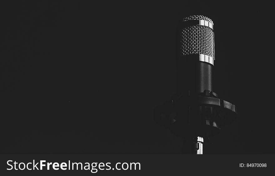 A microphone on a black background. A microphone on a black background.