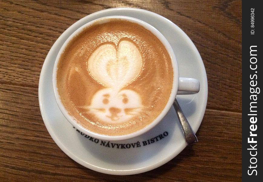 A cup of cappuccino with latte art of a bunny rabbit. A cup of cappuccino with latte art of a bunny rabbit.