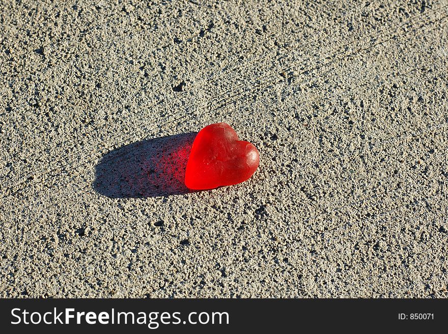 A gummy heart on the ground