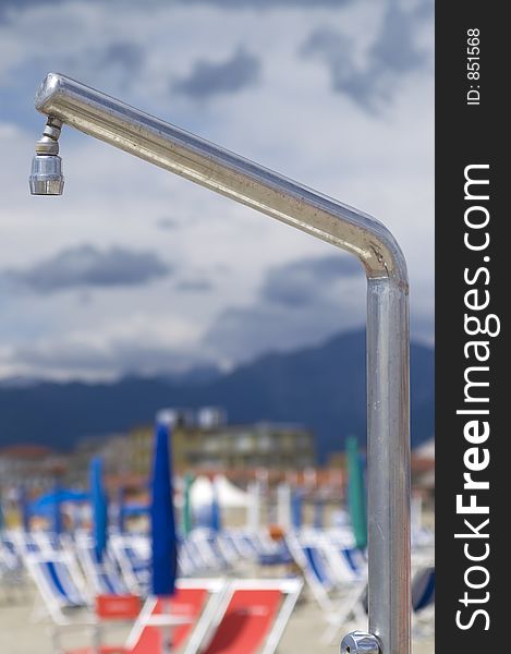 Close up of a shower in a beach in Tuscany. Close up of a shower in a beach in Tuscany