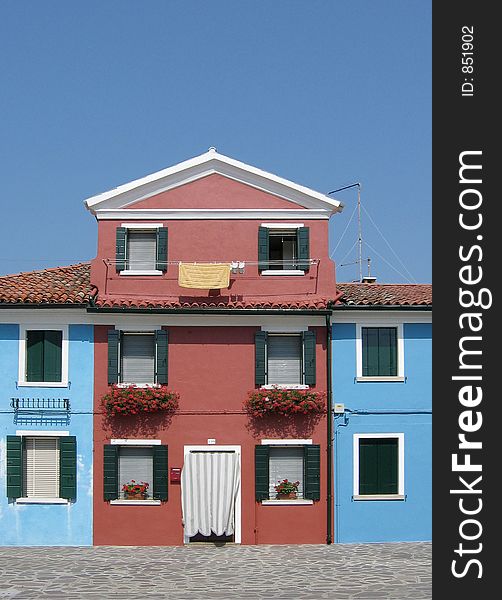 Brightly painted houses on Burano island, Venice, Italy. Brightly painted houses on Burano island, Venice, Italy.