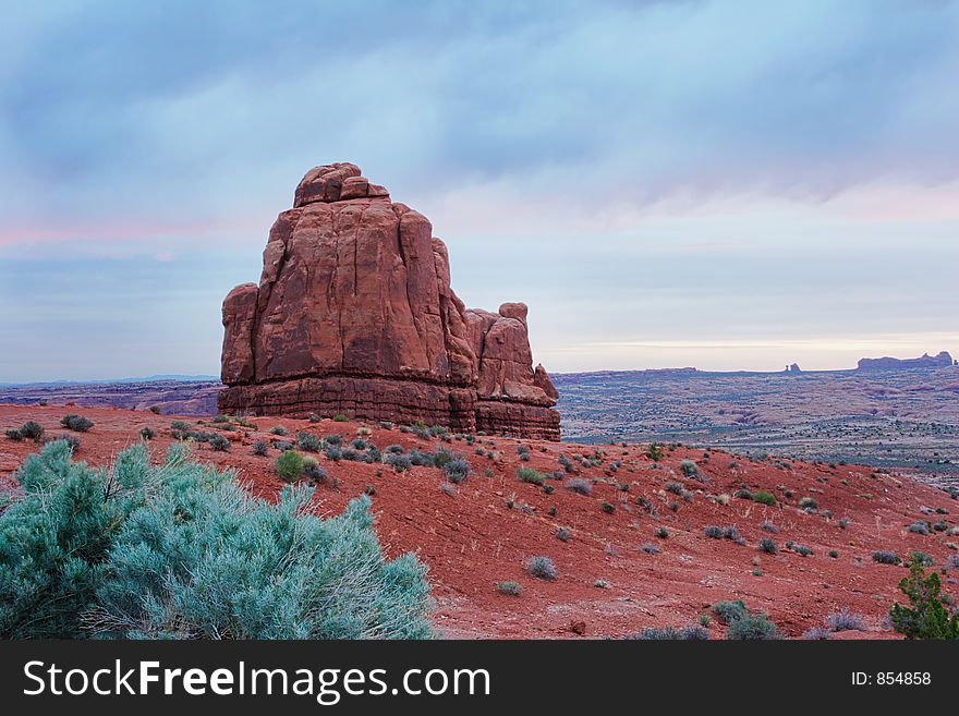 A rocky outcropping across from the La Sal Mountain range - Arches National Park, Utah. A rocky outcropping across from the La Sal Mountain range - Arches National Park, Utah.