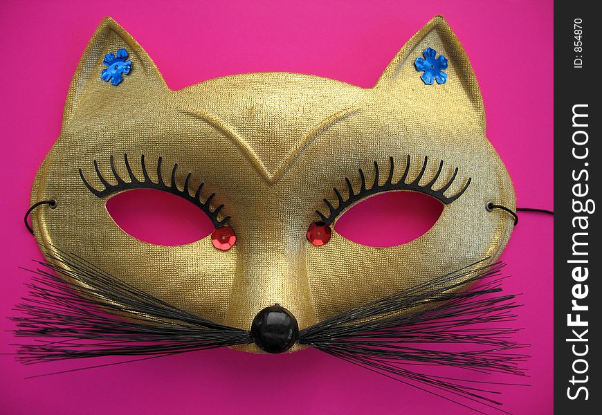 A golden cat mask. A golden cat mask.