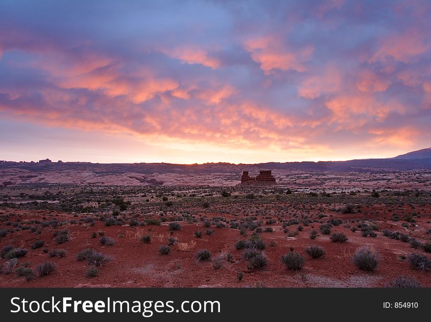 Pre-sunrise looking eastward toward the La Sal mountain area in Arches National Park. Pre-sunrise looking eastward toward the La Sal mountain area in Arches National Park.