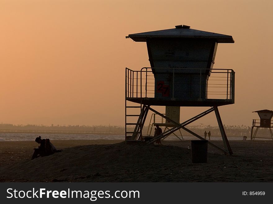 Silhoette of lifeguard post at sunset