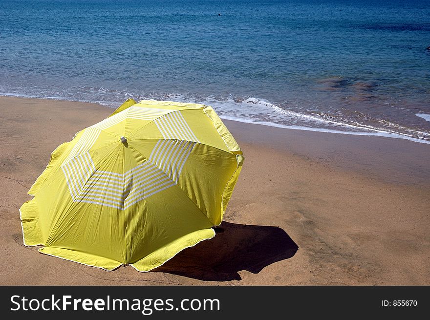 Yellow beach umbrella. Yellow beach umbrella