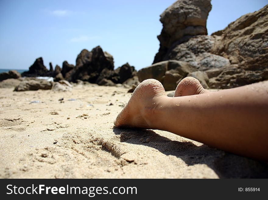 Feet relaxing on the beach. Feet relaxing on the beach