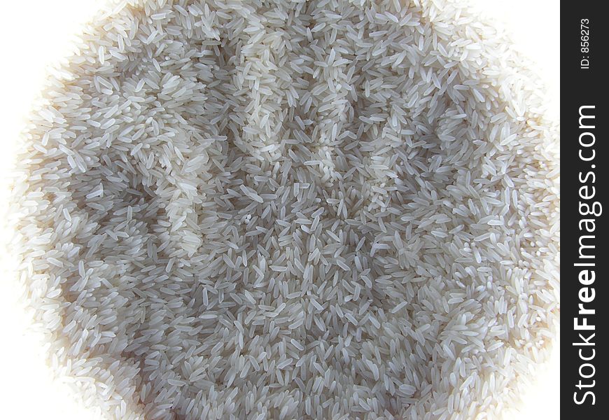 The rice is surrounded by a circular flourescent light tube. The rice is surrounded by a circular flourescent light tube.