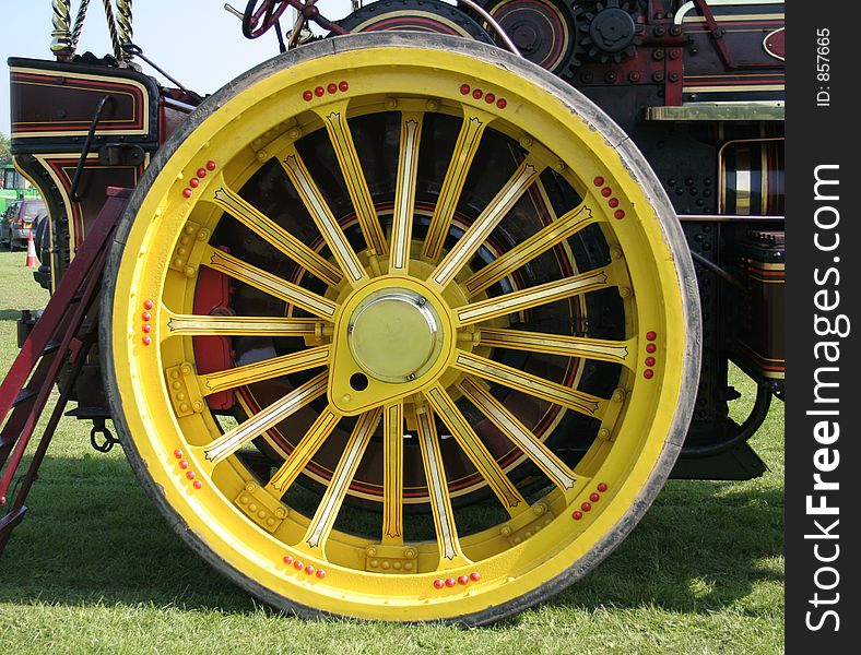 Beautiful yellow steam engne wheel which has been beautifully restored by craftsmen into this splendid state. Beautiful yellow steam engne wheel which has been beautifully restored by craftsmen into this splendid state