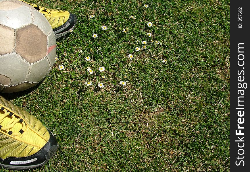 Soccer, boots, football, grass, green, ball, business, concept. Soccer, boots, football, grass, green, ball, business, concept