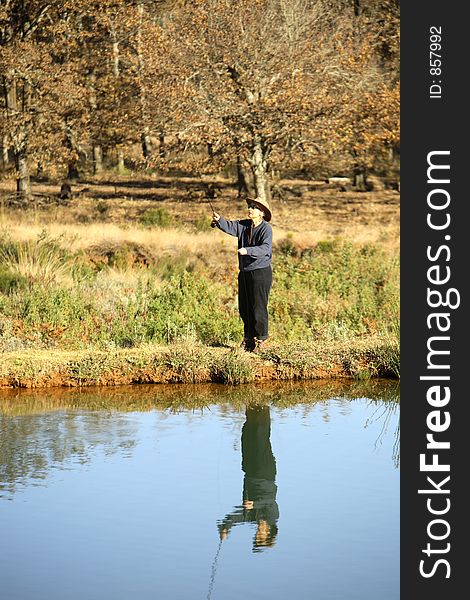 Lady casting a fly rod.