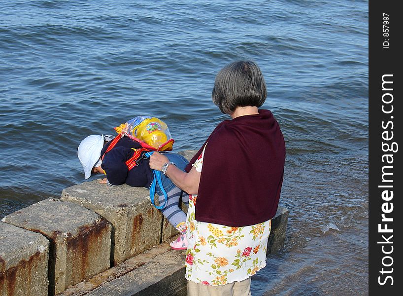 Grandmother and a grandchild by the sea