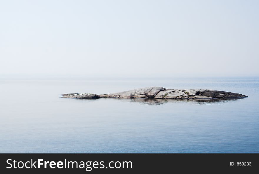 Rocky island in lake