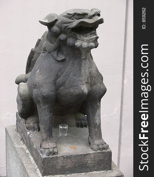 Figure of a fantasy dog at a japanese temple. Figure of a fantasy dog at a japanese temple